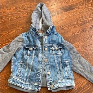 AE Ripped Jean jacket with gray sleeves and hoodie
